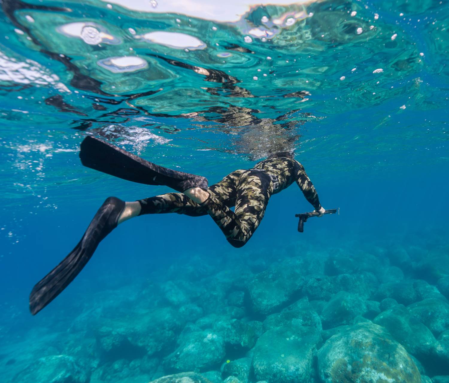 Long-blade fins over Kona reef
